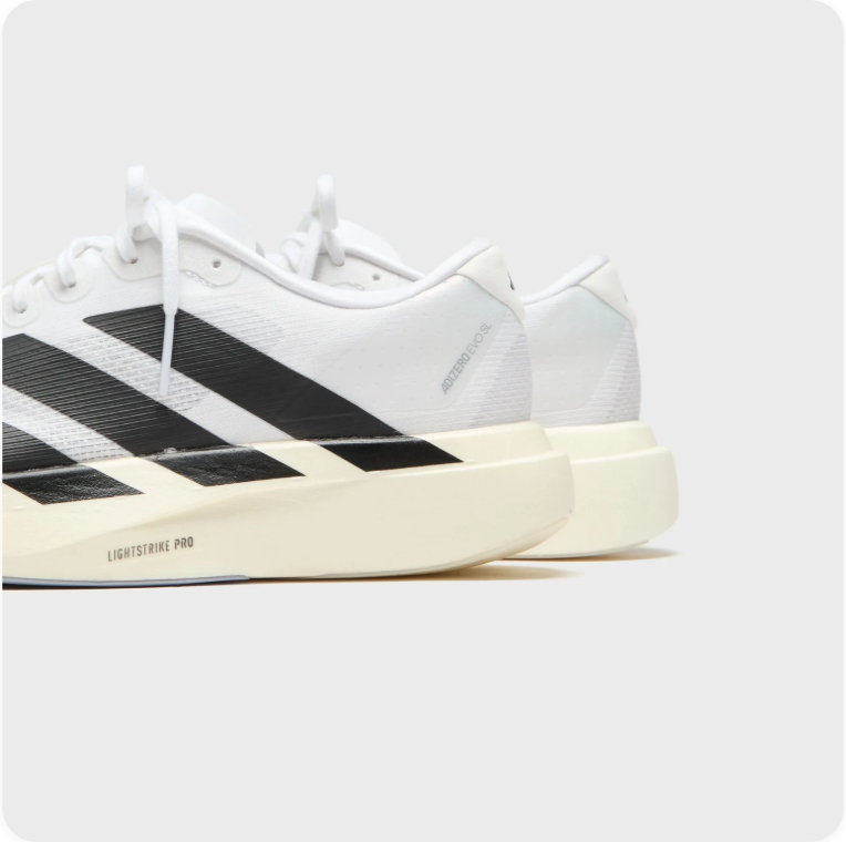 Adidas White and Black Low-Top Sneakers with Cream Soles