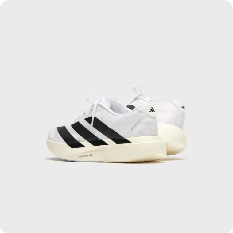 Adidas White and Black Low-Top Sneakers with Cream Soles