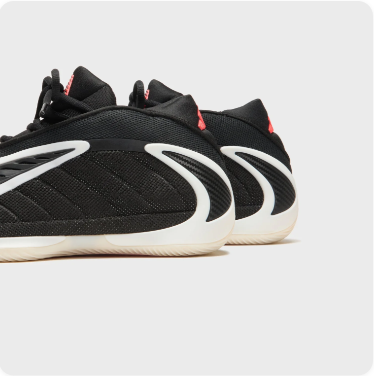 Adidas Black Sneakers with Sculpted Cream Soles and Red Accents