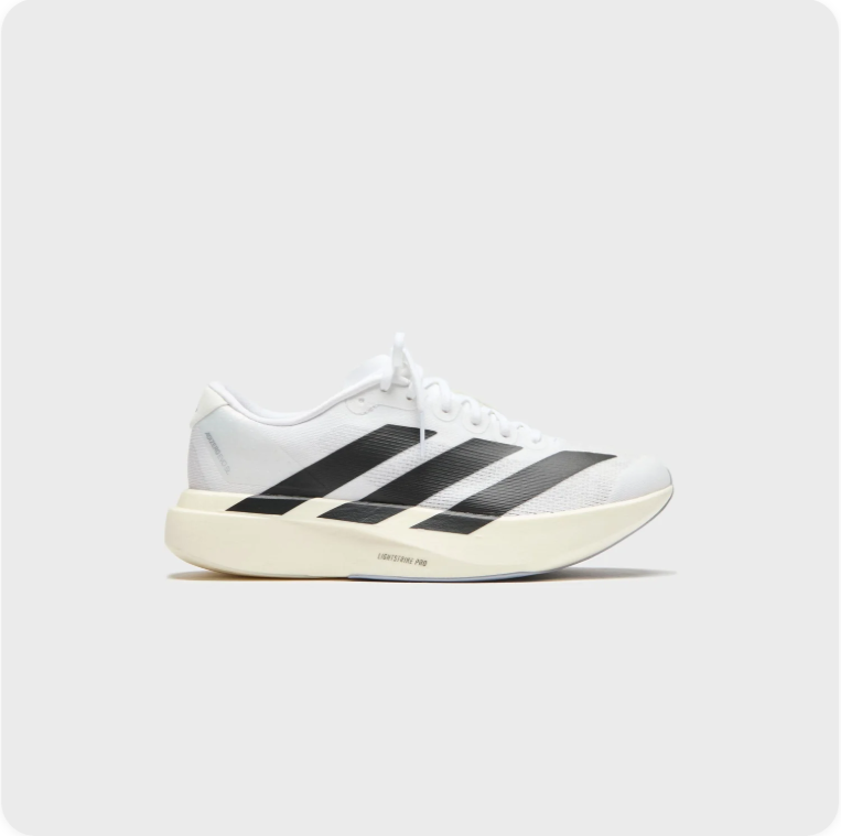 Adidas White and Black Low-Top Sneakers with Cream Soles