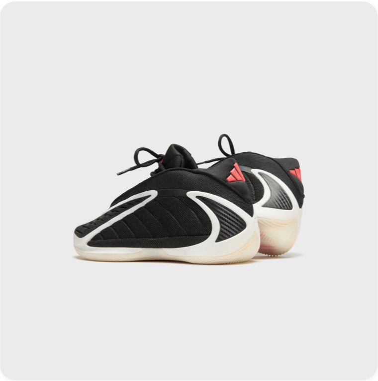 Adidas Black Sneakers with Sculpted Cream Soles and Red Accents
