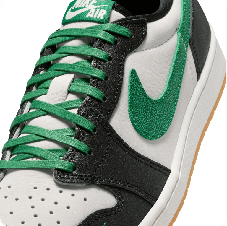 Air Jordan 1 Black and White Low-Top Sneakers with Green Accents and Tan Soles