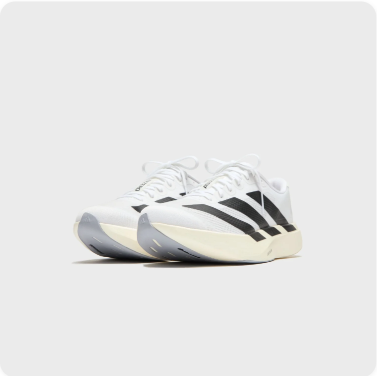 Adidas White and Black Low-Top Sneakers with Cream Soles